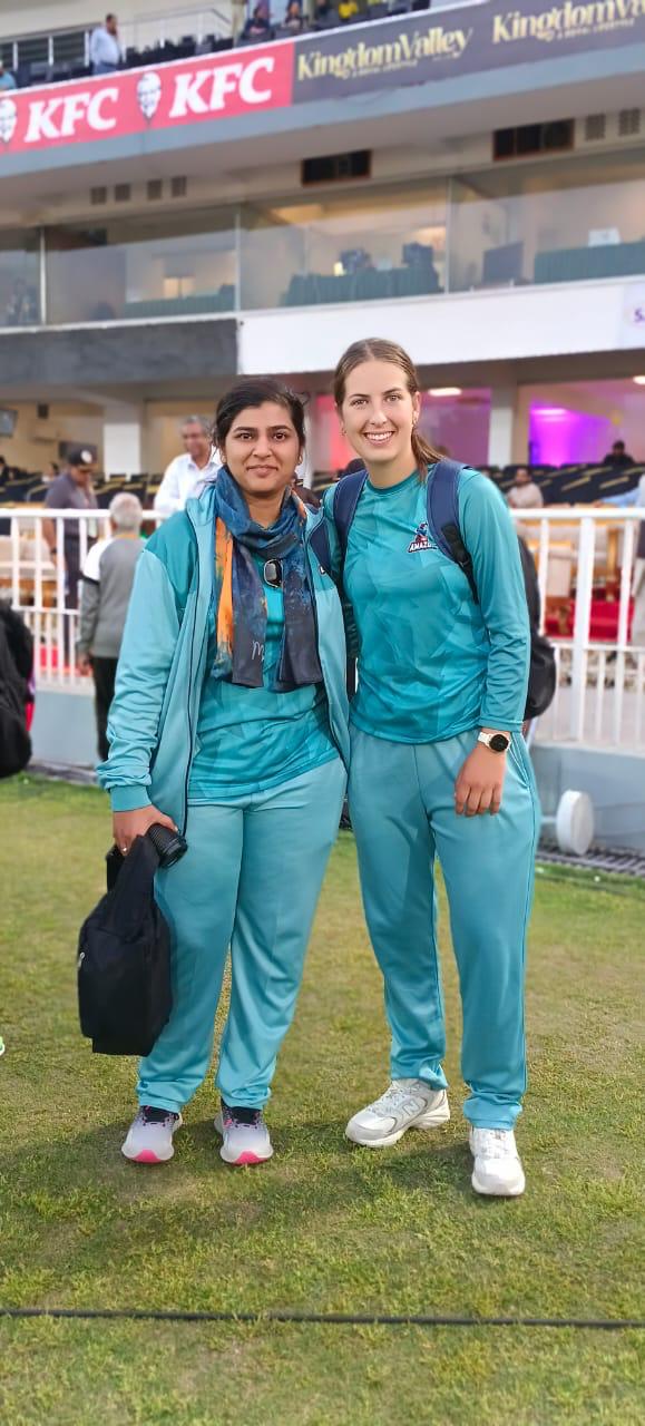 Dr. Saima Naseem with a cricketer at a professional cricket ground