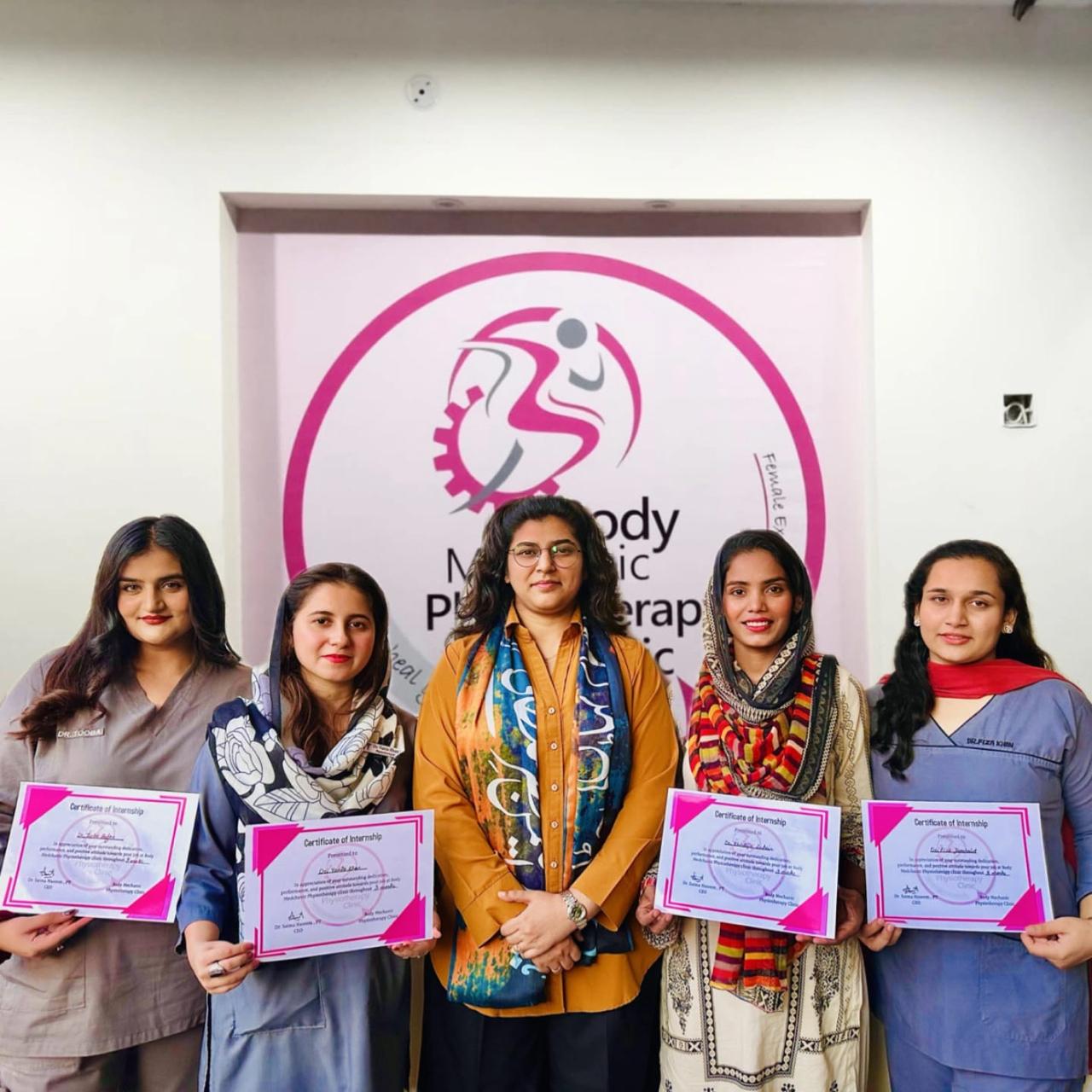 Dr. Saima Naseem with interns at a Body Mechanic clinical training certificate distribution